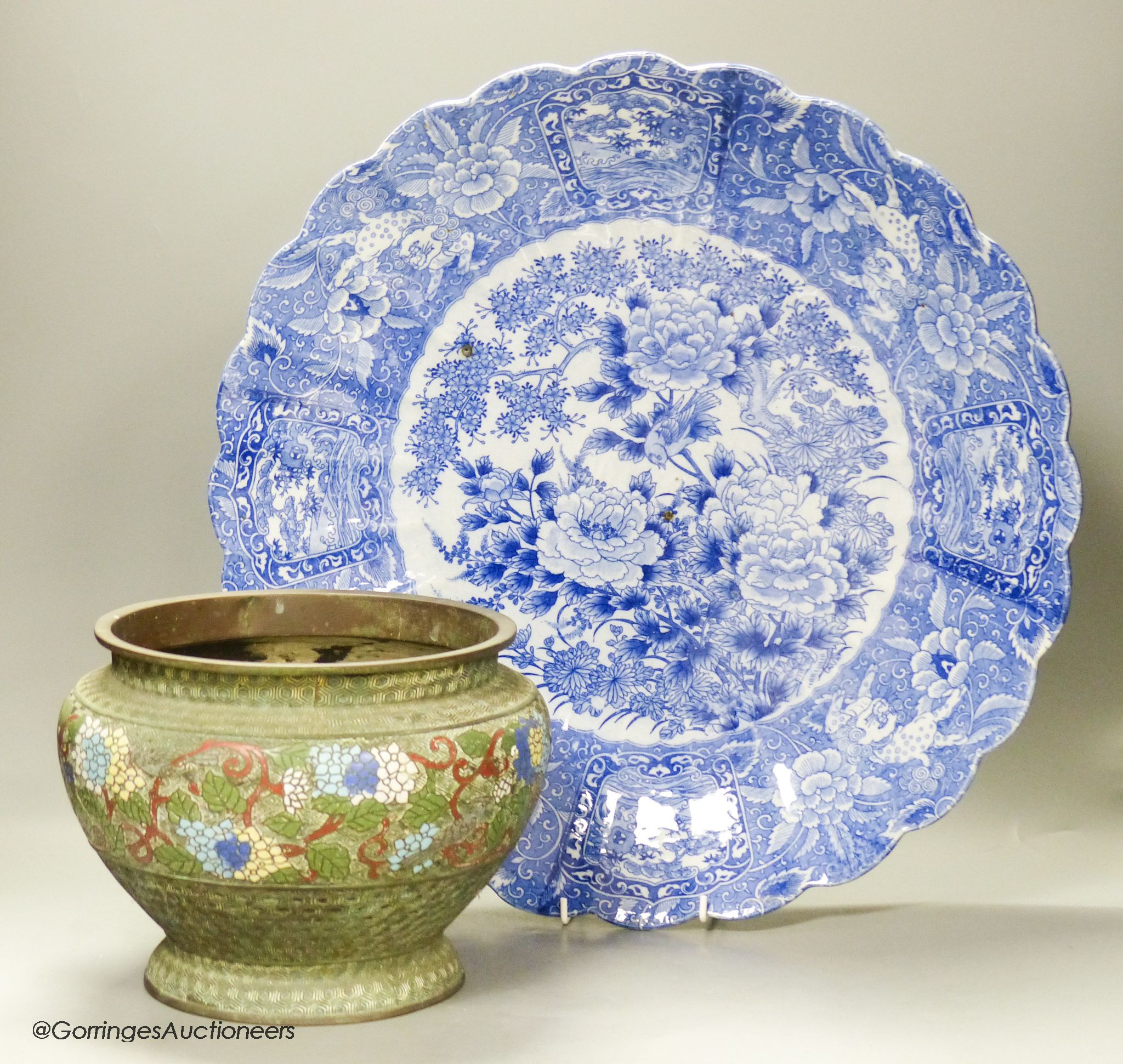 A Japanese blue and white charger, diameter 46cm, and a champleve enamel jardiniere